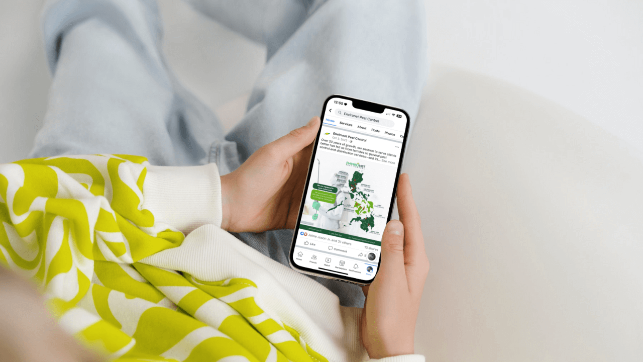 Blog Cover_Get Pest Control Where You Need It Introducing Our Location-Based Services on Facebook Pages Environet Pest Control_a woman holding a phone showing off a Facebook page