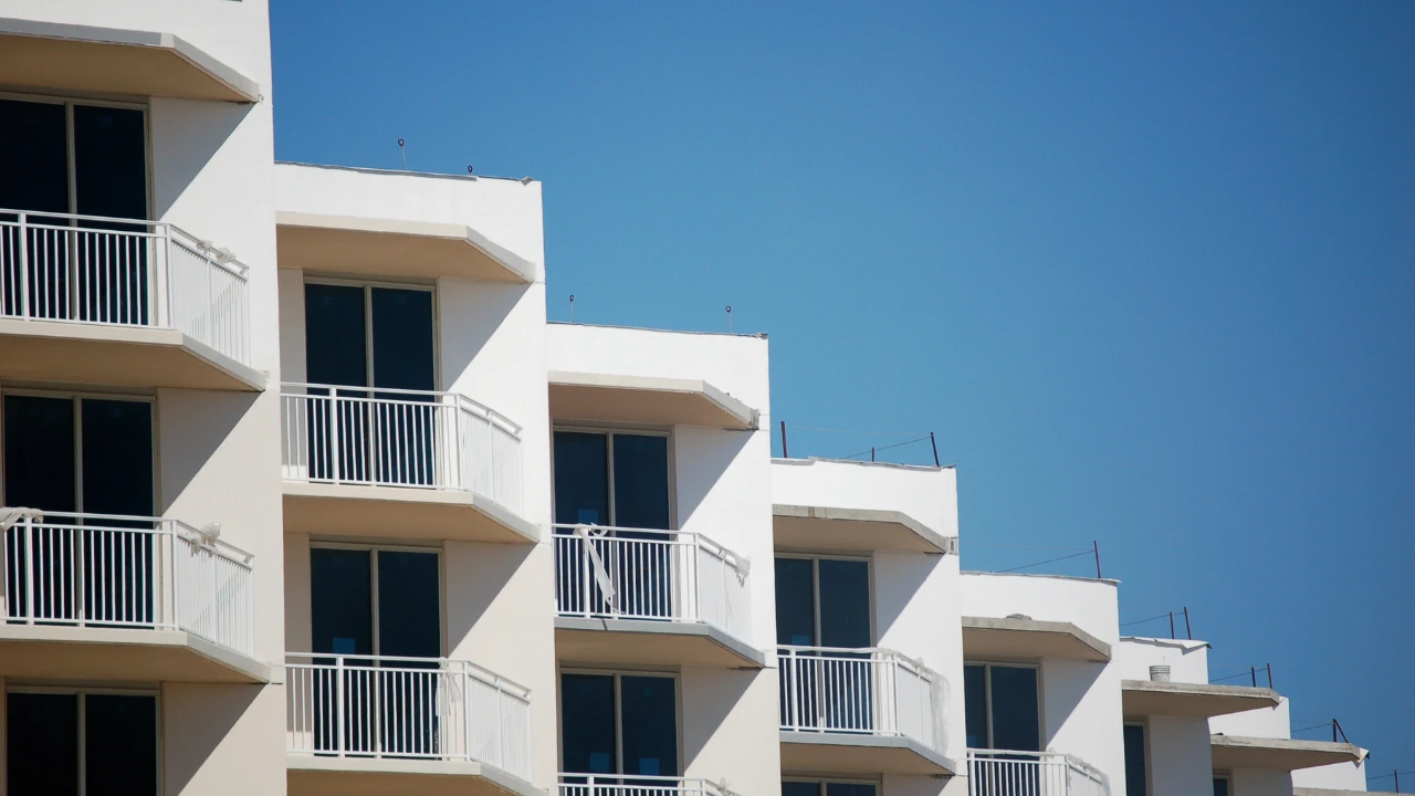 White balconies line the facade of a high-rise building, illustrating the contemporary style of urban condo living, where residents must stay vigilant against pest problems.