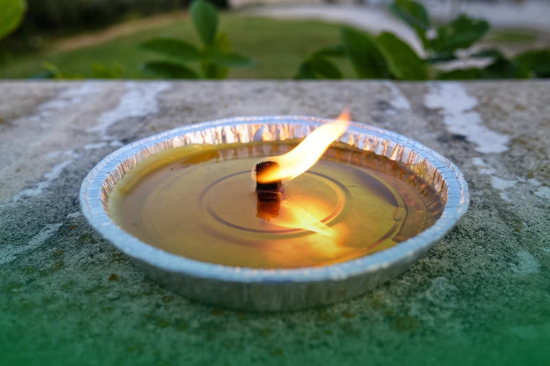 Use Natural Repellents citronella anti-mosquito candles
